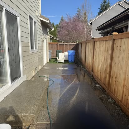 Sidewalk pressure washing in progress